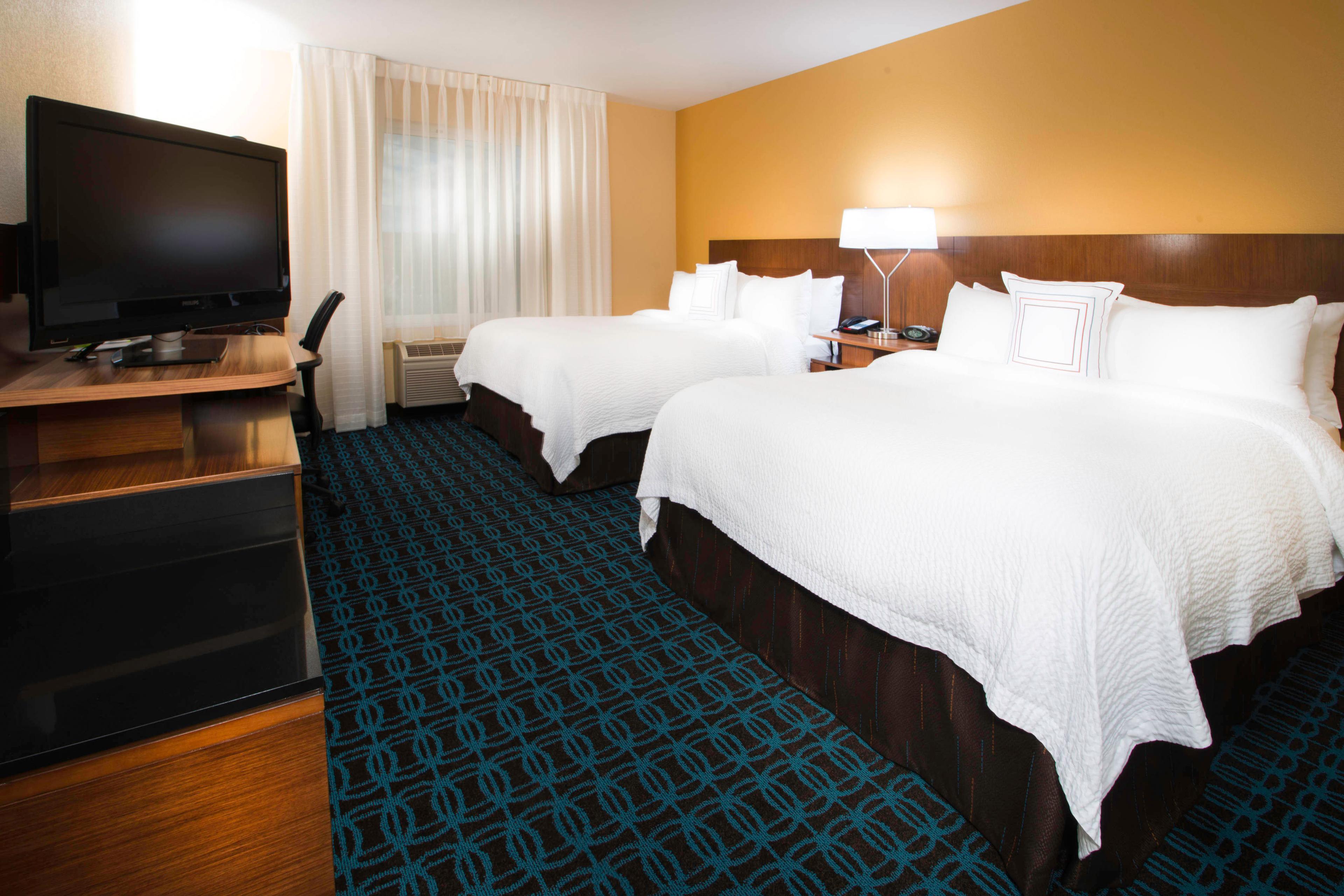 Our guest rooms featuring two queen-size beds with fresh linens, have a work desk, 42-inch television, refrigerator and microwave.