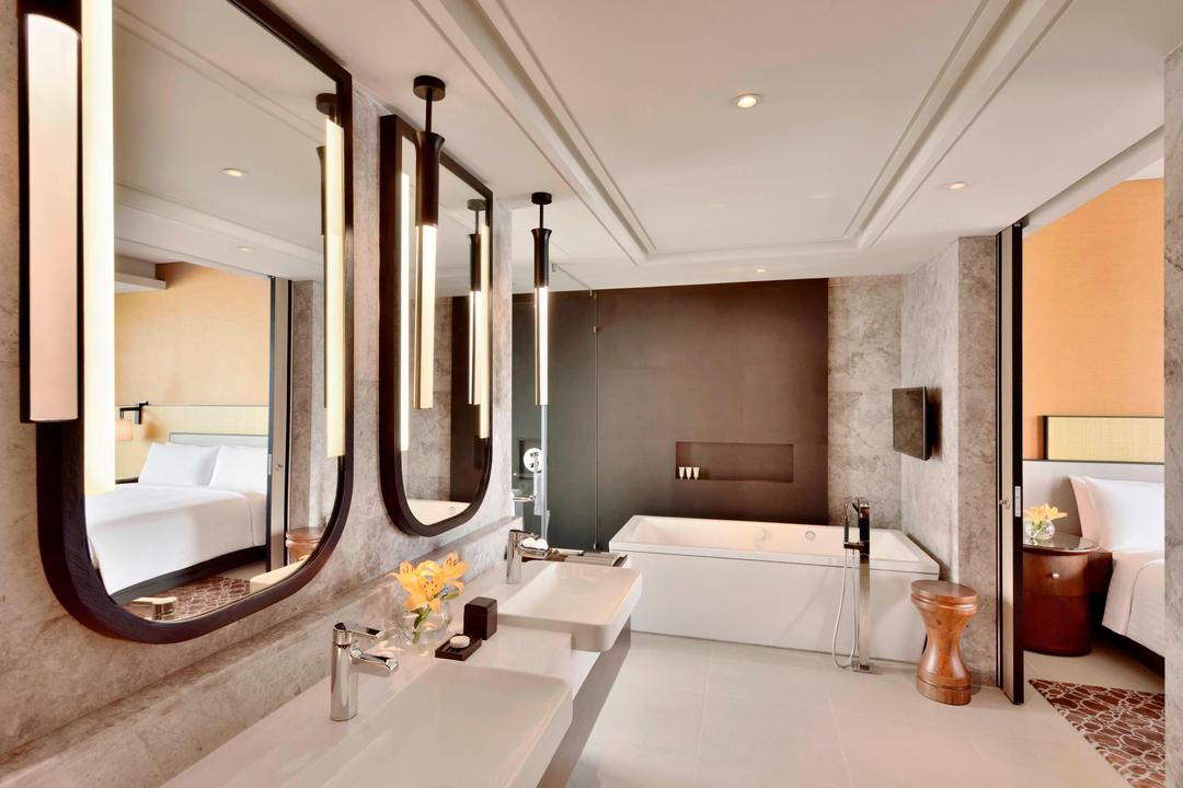 Pamper yourself in our Presidential Suite bathroom, which offers two vanity counters, a spacious dressing room, rain shower and soaking tub.