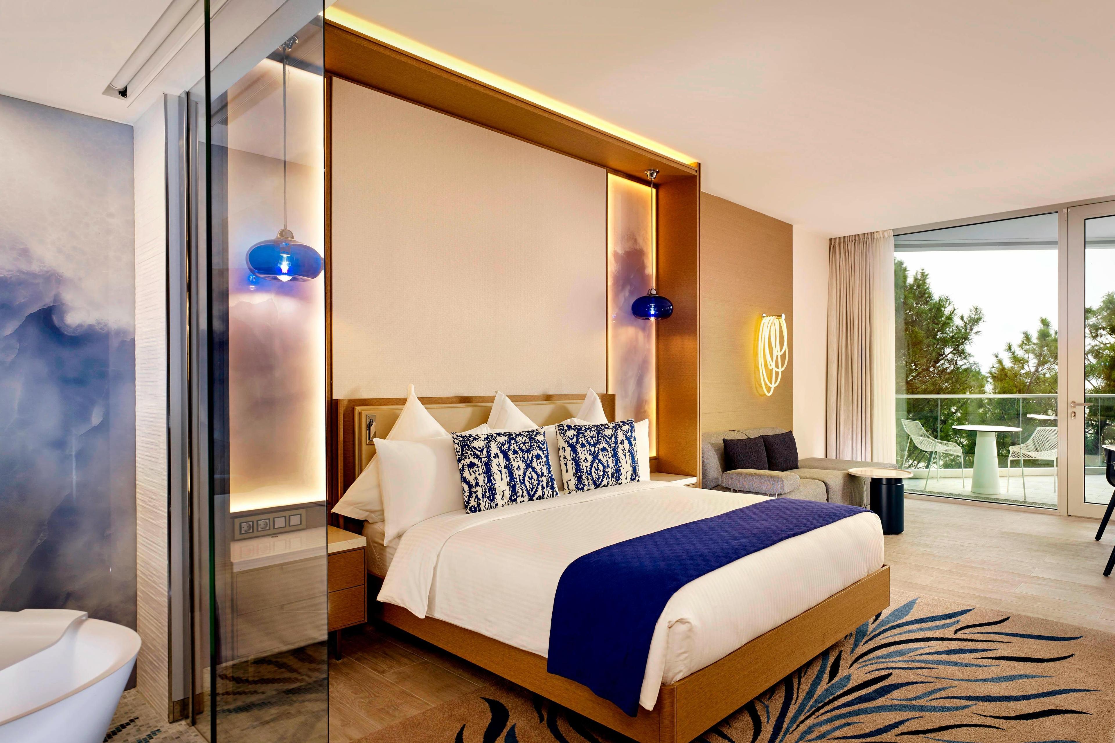 Our King guest room is where modern design meets absolute comfort. Bold, sea-inspired detailing invites you to relax and enjoy your stay, with panoramic views and a private balcony.